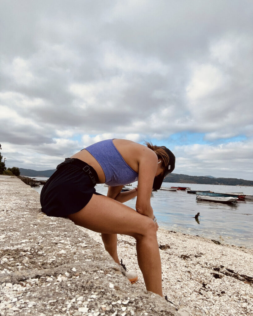 Carleth seated on a rock tired of a running session