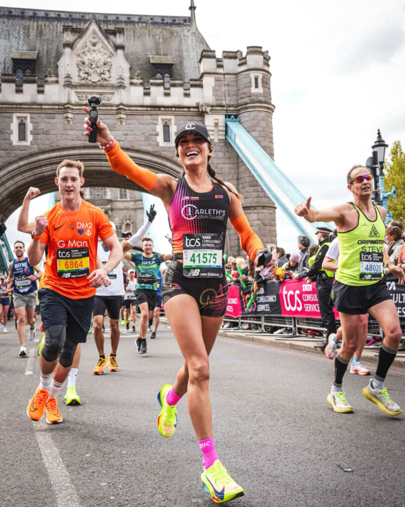 Carleth running the London Marathon smiling at people